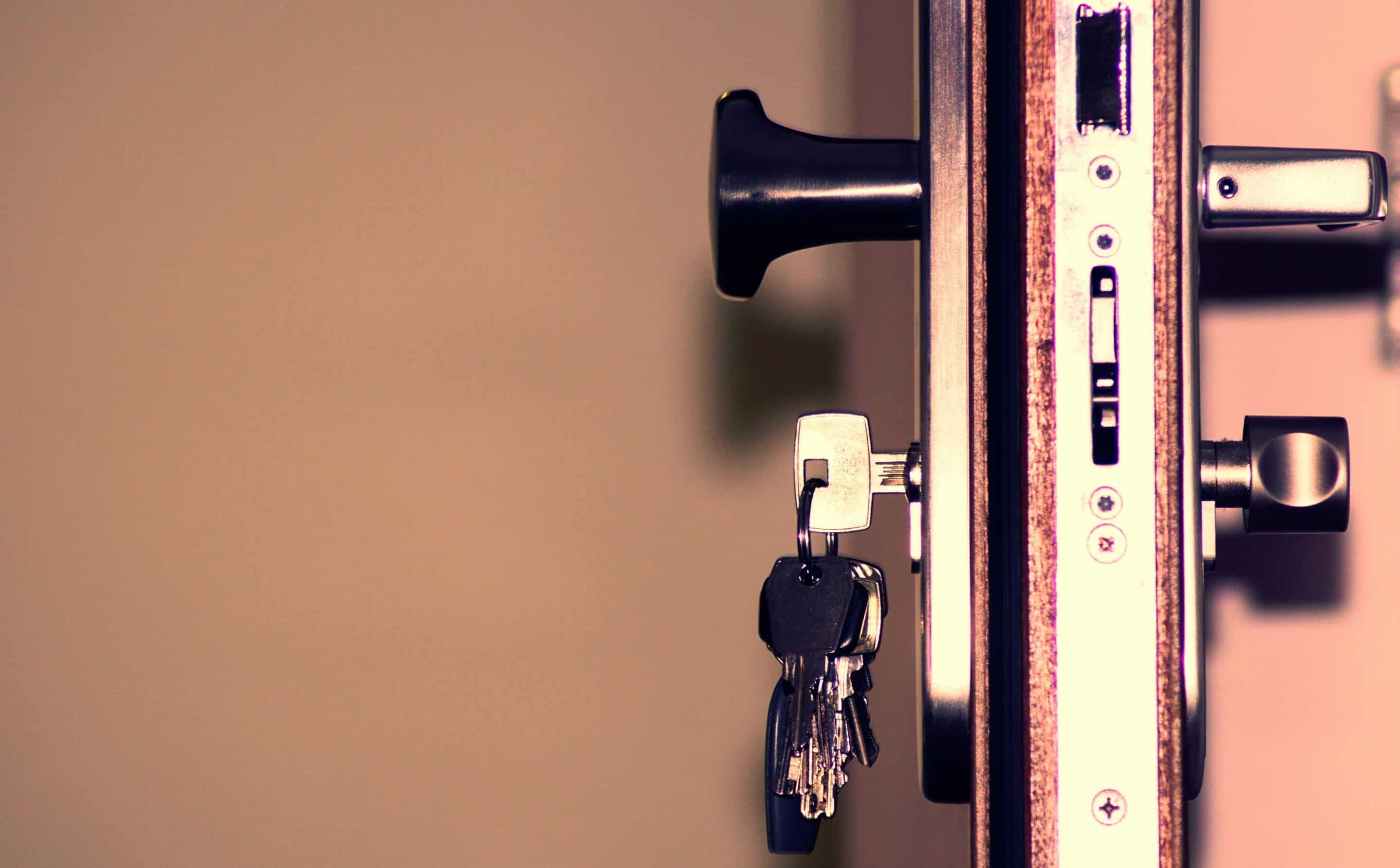 Close-up of a key turning in a UPVC door lock for home security and locksmith services in Belfast.