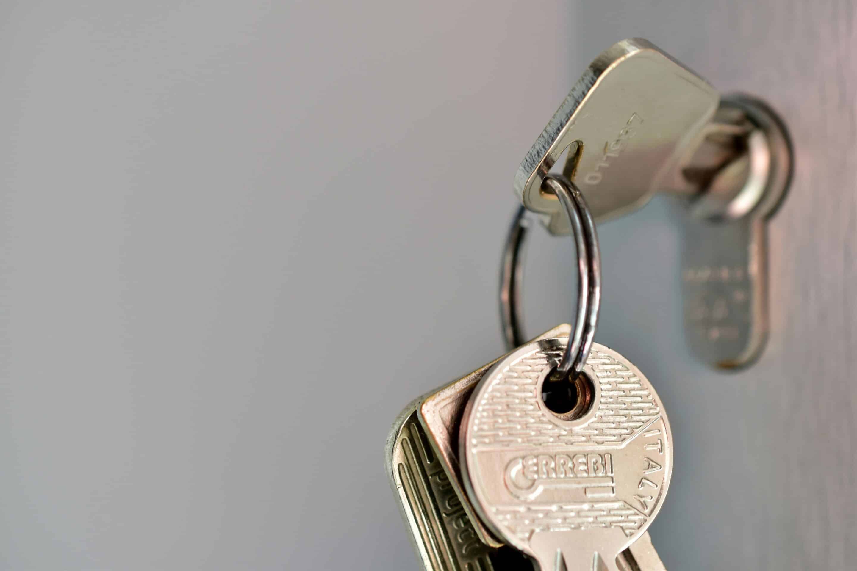 Residential UPVC door lock and key, highlighting reliable locksmith solutions in Belfast.